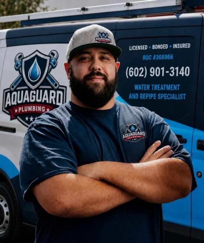 Gennaro Izzo, owner of Aquaguard Plumbing, by his van